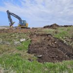 removing overburden at the Sandy Cove restoration site